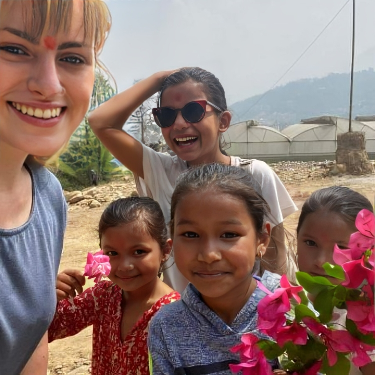 Our foreign guest is taking a selfie with the Seson Homestay's Kids.